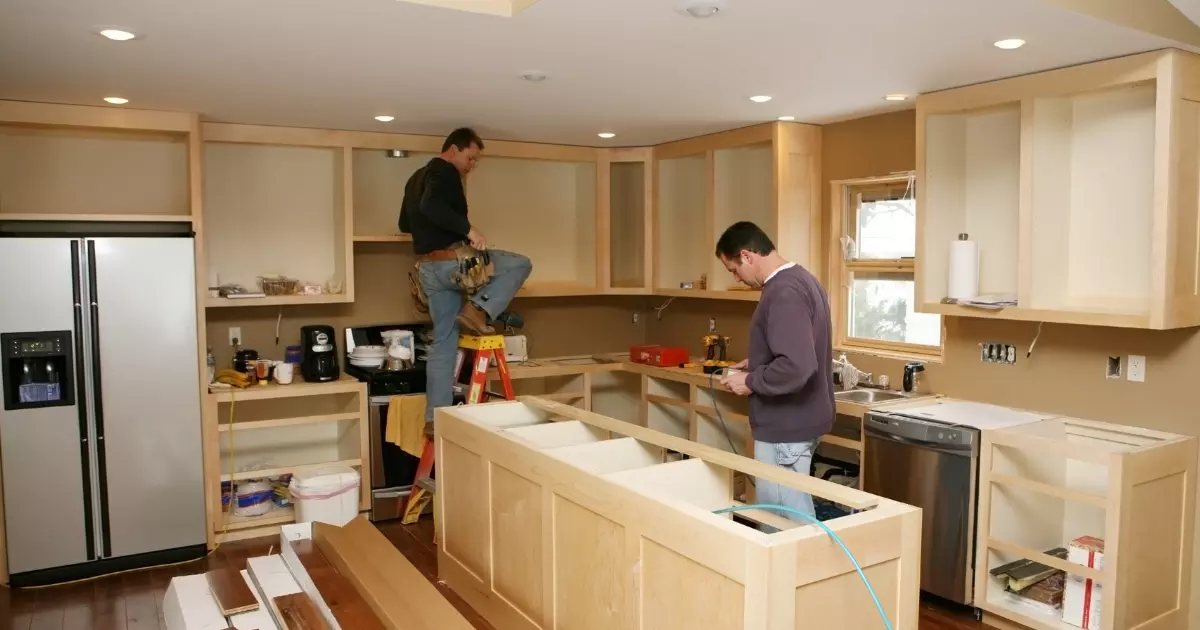 A couple of men in a kitchen